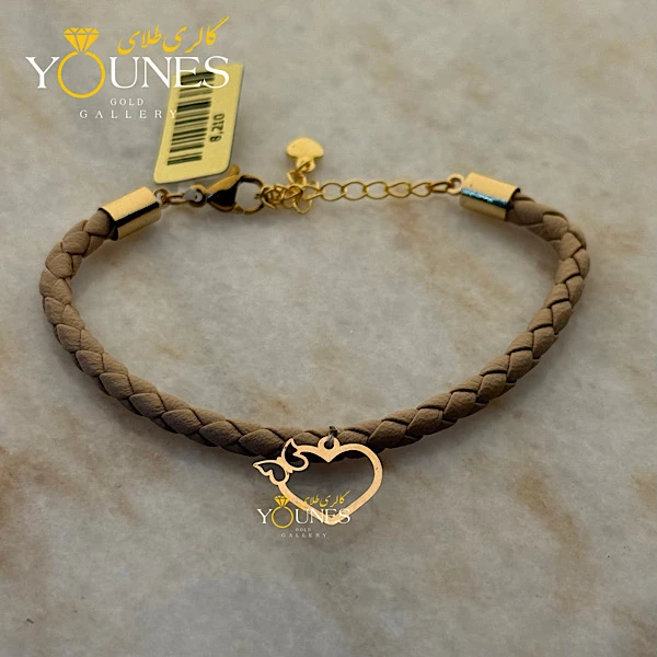 دستبند چرم کرمی پروانه قلبی طلا